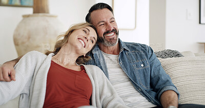 Buy stock photo Bonding, hug and thinking with couple on sofa in living room of home together for weekend planning or vision. Happy, idea and love with mature people embracing in apartment for break or reflection