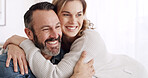 Happy, hug and mature couple in home with love, bonding or connection in marriage together. Smile, relationship and woman embracing man with support, safety and sweet moment in living room at house.