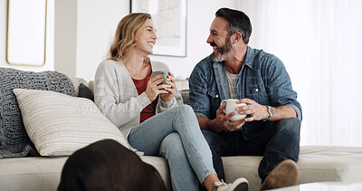 Buy stock photo Coffee, laughing and love with couple on sofa in living room of home together for break or conversation. Drink, relationship and relax with mature people in apartment for comedy, funny joke or humor