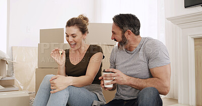 Buy stock photo Boxes, new home and couple with keys, excited and bonding together with achievement. Success, rental apartment and man with woman, property owner and goals with milestone, investment and real estate