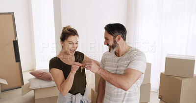 Buy stock photo Happy couple, moving in and key to new home for property ownership, investment and rent. Man, woman and giving access to real estate for relocation, mortgage and excited for fresh start together