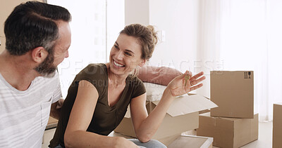 Buy stock photo Moving in, couple and happy with keys in new home for property purchase, relocation and investment. Boxes, mature man and excited woman with ownership of dream house for mortgage security and support