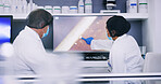Lab, scientists and people with monitor, medical research or collaboration for project and pointing. Back, biology and team with computer for cell analysis, screen and conversation for innovation