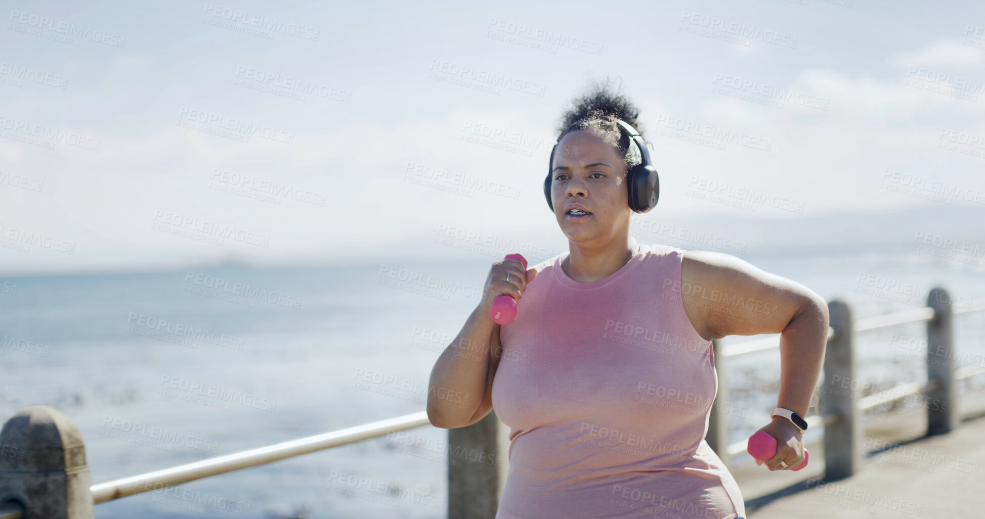 Buy stock photo Workout, headphones and woman by beach with music, podcast or running for fitness. Sport, audio and plus size person to lose weight with radio, cardio and exercise or training outdoor with space