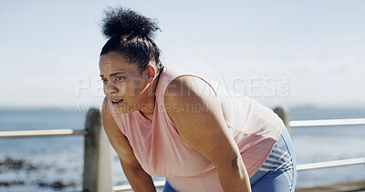Buy stock photo Fitness, woman and tired runner by sea for health, wellness or workout recovery at promenade. Fatigue, sports or plus size person rest outdoor, breathing or exhausted from cardio challenge with space