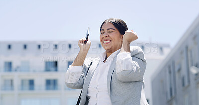 Buy stock photo Woman, phone and celebration with fist pump in city, happy and good news for real estate sale. Person, agent or realtor with smartphone, notification and success with goals for property in Brazil