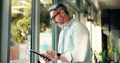 Buy stock photo Window, office and business man on tablet for finance review, online trading and investment news. Typing, scroll and person on digital tech for financial report, budget planning and fintech website