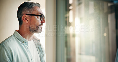 Buy stock photo Businessman, serious and thinking by window in office for startup vision, business plan or ideas. Space, mature person or reflection at work for company development, funding solution or brainstorming