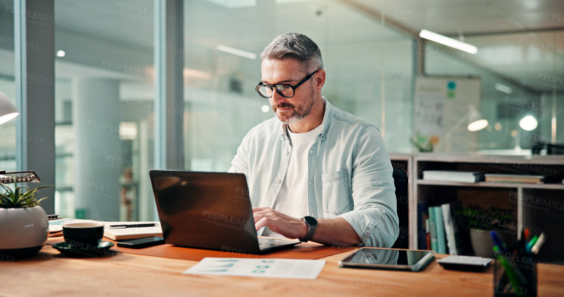 Buy stock photo Typing, employee and man with laptop, office or accountant with financial report, online or website. Serious, bookkeeper and mature person with tech for investment analysis, risk management and data