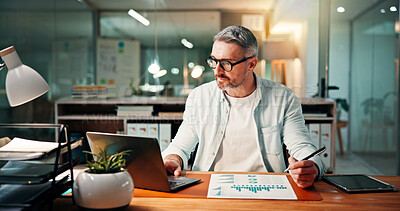 Business, graphs and man with laptop, night and documents with planning, investment and email. Mature person, evening and employee in office, computer and charts with trading, report and website info