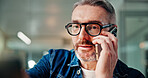 Man, glasses and call in office with phone, talk and discussion in company. Serious, communication and business person in conversation with technology, digital and professional in workplace.