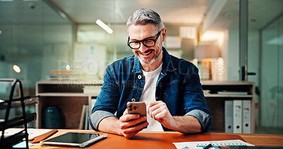 Buy stock photo Phone, laugh and business man in office for social media break, typing message and email. Creative, working late and mature worker on smartphone for internet joke, website or online research at night