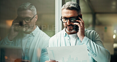 Buy stock photo Businessman, night and discussion with phone call, documents or report for office statistics. Mature man, employee or analyst with graph, mobile smartphone or company analytics for performance review
