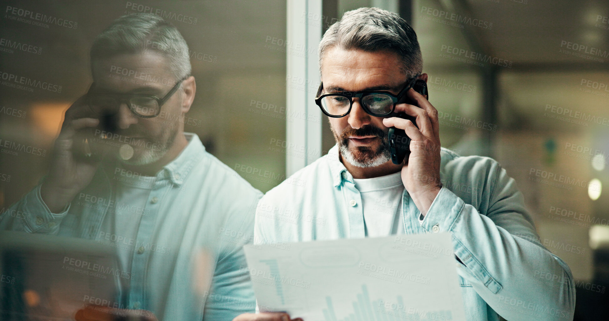 Buy stock photo Businessman, night and discussion with phone call, documents or report for office statistics. Mature man, employee or analyst with graph, mobile smartphone or company analytics for performance review