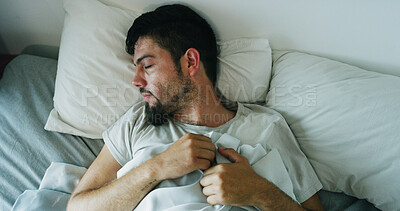 Buy stock photo Fatigue, man and sleeping on bed at house with nightmare, depression and mental exhaustion. Above, male person and restless with sweat, bad dream and fear for trauma ptsd with withdrawal symptoms