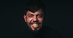 Fear, crisis and portrait of man in studio for psychology, panic and schizophrenia symptoms. Anger, frustrated and mockup space with face of person with bipolar disorder on black background for rage