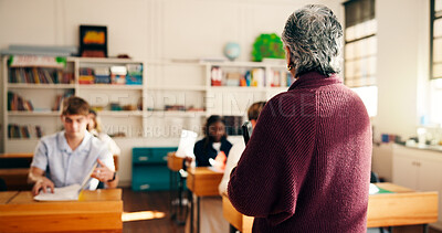 Buy stock photo Teacher, education and talking with woman in classroom for biology, learning and lecture. Presentation, discussion and high school with teenagers or students on campus for knowledge and study