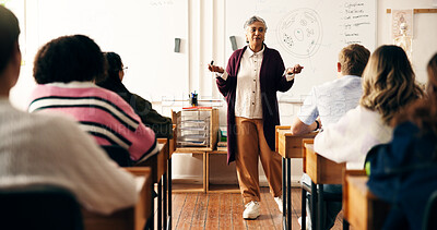 Buy stock photo Educator, students or woman in classroom with whiteboard, speaking or listen in biology lesson. Knowledge, nature science or mature high school teacher in academy with teens, learning for future exam