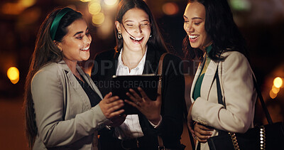 Buy stock photo Laughing, night and tablet with business women outdoor together for conversation or planning. App, bokeh and funny with corporate employee working late for discussion or research deadline as friends