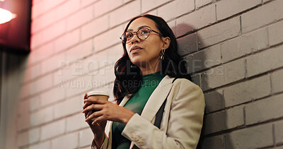 Buy stock photo Woman, thinking and waiting with coffee for night out, schedule or delay in outdoor city. Female person, travel and contemplating with beverage in late evening for date or rendezvous in urban town