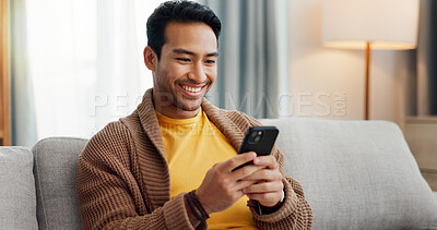 Buy stock photo Phone, reading and smile with man on sofa in living room of home for social media scrolling. App, communication and information with happy person in apartment for internet search or text message