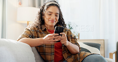 Buy stock photo Phone, relax and happy woman in home for app, social media post and reading news. Cellphone, living room and person on internet for online blog, communication and check message with notification