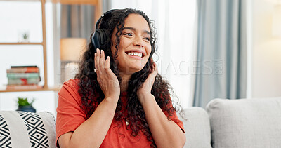 Buy stock photo Headphones, music and smile with woman on sofa for streaming service, audio app or connection. Online song album, radio subscription and relax with person in living room of home for sound and break