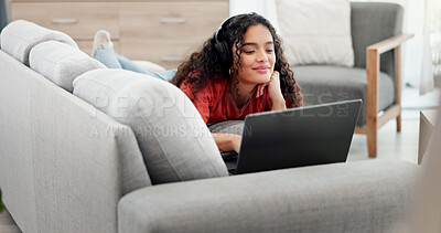 Buy stock photo Woman, laptop and headphones on sofa for relax, social media and video streaming or website in home. Movie, internet audio and female person on couch with technology, break and watching film on app