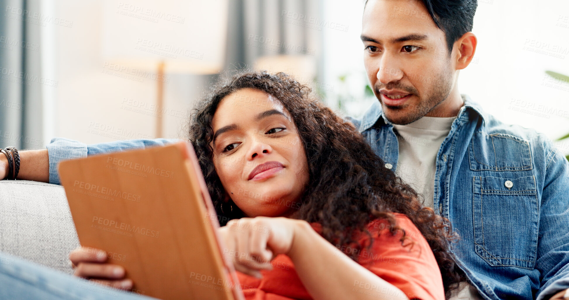 Buy stock photo Relax, streaming and couple in home with tablet, online website or digital app for movie search. Support, film choice or man and woman in living room with tech, touch screen and resting on weekend 