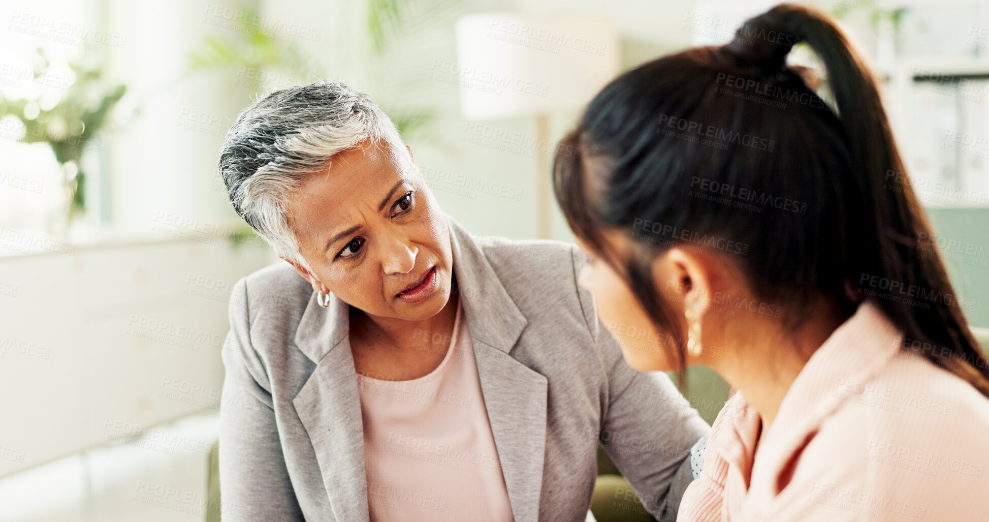 Buy stock photo Sad, counseling and help with women at therapist office for mental health, depression and empathy. Psychologist, grief recovery and trauma with people in clinic for support, compassion and therapy