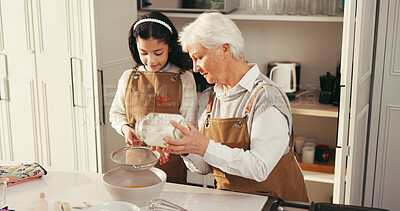 Buy stock photo Baking, flour and child with grandmother in kitchen for teaching, bonding or development. Happy, learning and girl kid with senior woman for preparing dessert, cake or cookies together in home.