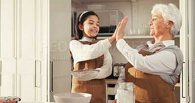 Buy stock photo Happy grandma, grandchild or baking with high five in kitchen for success or dessert recipe in home. Senior woman, girl or kid with smile, flour or apron for culinary teamwork or learning together