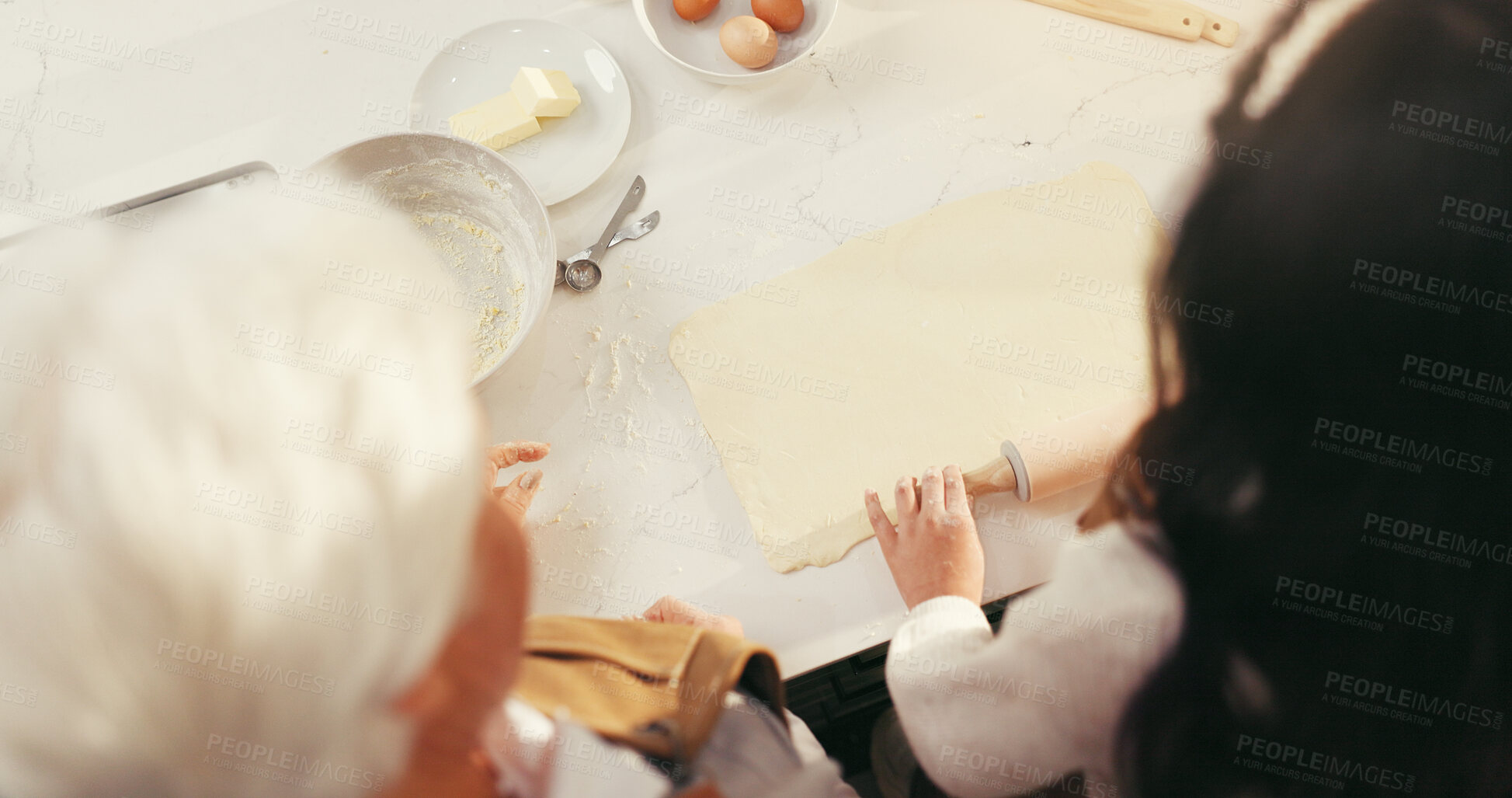 Buy stock photo Baking, grandmother and hands of grandchild with rolling pin in home for learning, dough or help. Family, senior woman or girl kid with pastry preparation from above for scones recipe and development