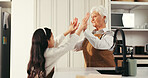 Girl, grandmother and high five with cooking in kitchen, success and motivation with bonding. People, grandma and child with smile, baking or support with goals, celebration and food at family house