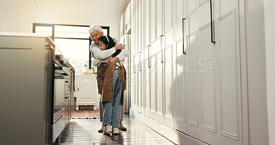 Buy stock photo Hug, reunion and senior woman in kitchen with child, happy family and support for school holiday. Love, relax and people in home with learning, bonding and baking in retirement for education.