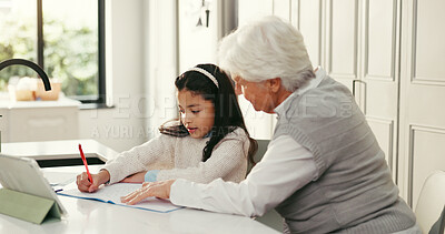 Buy stock photo Girl, grandmother and help with homework, writing and book with support, online course and education in home. People, grandma and child with guide, learning and care for development at family house