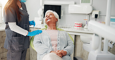 Buy stock photo Dentist, consultation and senior woman in office, conversation and teeth whitening. People, doctor and patient with dental cleaning, discussion or inspection with cosmetic dentures or hygiene results