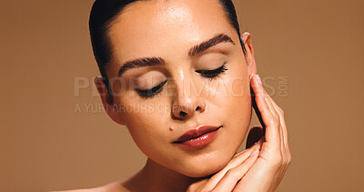 Buy stock photo Beauty, makeup and face of woman in studio for cosmetics, transformation and makeover. Space, eyes closed and person with confidence, facial glow and salon aesthetic for skincare on brown background