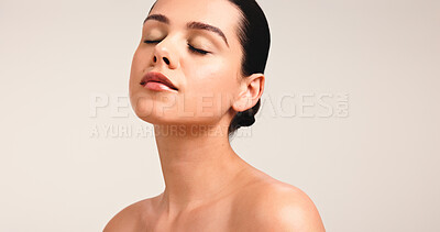 Buy stock photo Face, woman and beauty in studio for skincare, wellness or glow on white background. Mockup space, eyes closed with clean girl makeup or dermatology for healthy skin shine, cosmetics or natural look