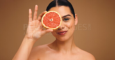 Buy stock photo Portrait, woman and grapefruit with smile for skincare, natural beauty and facial glow. Happy, person and fruit for collagen, vitamin c and organic ingredients of treatment shine in studio background