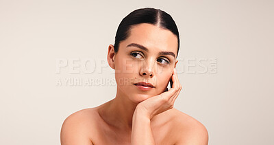 Buy stock photo Dermatology, woman and thinking in studio with makeup, self care practice and skin routine for beauty. Skincare, spa treatment and person with space, contemplating and cosmetics on white background.