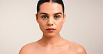 Skincare, cosmetic and portrait of woman in studio with natural, beauty and facial glow. Serious, mockup space and face of female person from Brazil with dermatology for wellness by white background.