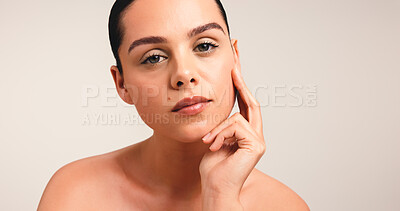 Buy stock photo Girl, portrait and beauty with touch in studio, results and natural makeup with glow on background. Woman, model and pride with transformation, mock up space and cosmetics for skincare in France