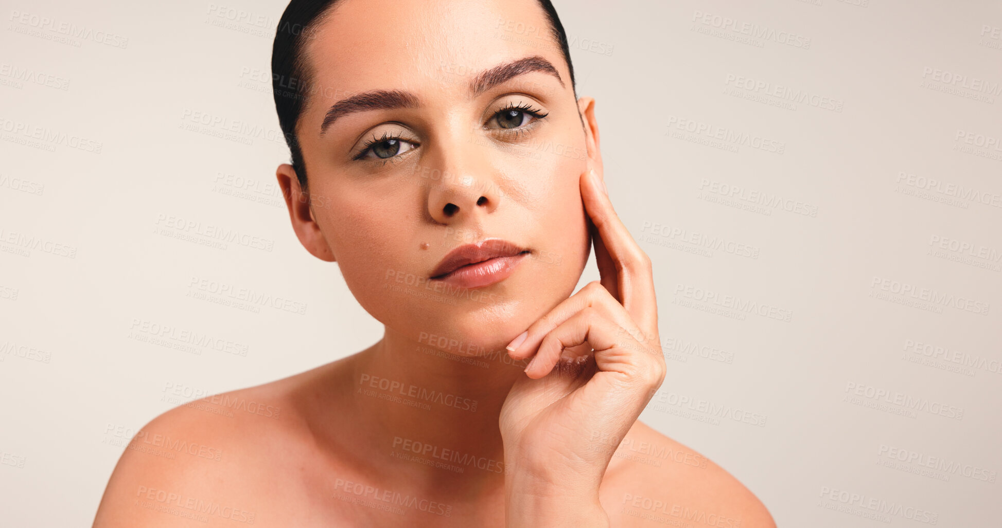 Buy stock photo Girl, portrait and beauty with touch in studio, results and natural makeup with glow on background. Woman, model and pride with transformation, mock up space and cosmetics for skincare in France