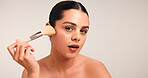 Woman, makeup brush and portrait with beauty in studio, powder and application with pride on background. Girl, cosmetic tools and foundation with skin, confidence and mock up space in Australia