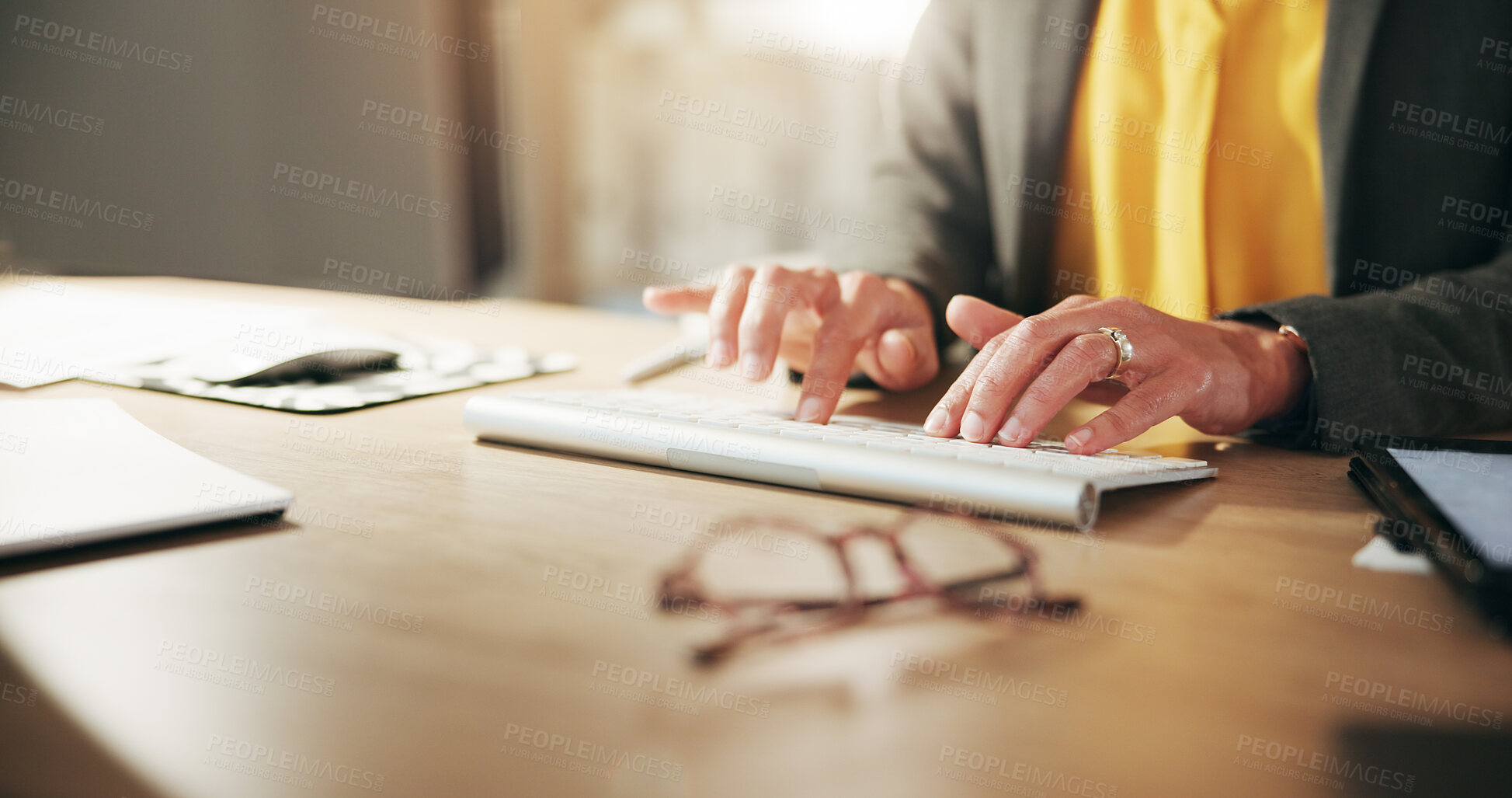 Buy stock photo Hands, keyboard and typing with business person at desk in office for administration or report. Computer, planning and research with professional employee in agency workplace for email feedback