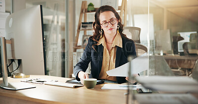 Buy stock photo Business, documents and reading with financial woman in office at night for review of information. Computer, finance and paperwork with corporate employee in workplace for evening administration