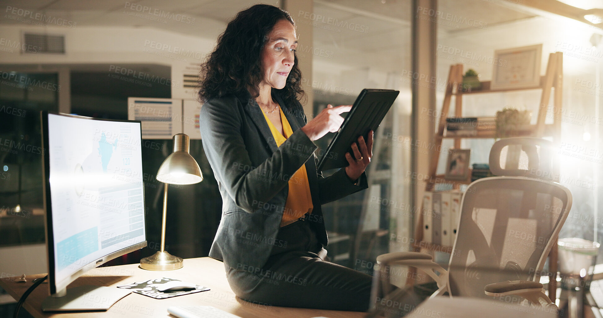 Buy stock photo Night, employee and woman with tablet in office, financial analyst or preparing for proposal on web. Business, accountant and person with computer for investment opportunity, deadline or working late