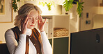 Business woman, headache and night with stress in office for overworked, pressure or burnout. Mature, female person or frustrated employee with migraine or fatigue for mental health or deadline