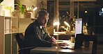 Man, reading and laptop at night in office with review, work article and deadline. Mature person, overtime and computer for research, feedback and thinking for draft task in publishing company
